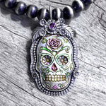 La Catrina Sugar Skull  Pendant Set In Sterling Silver with Purple Faceted Stone copyright chisholm trail designs 2025